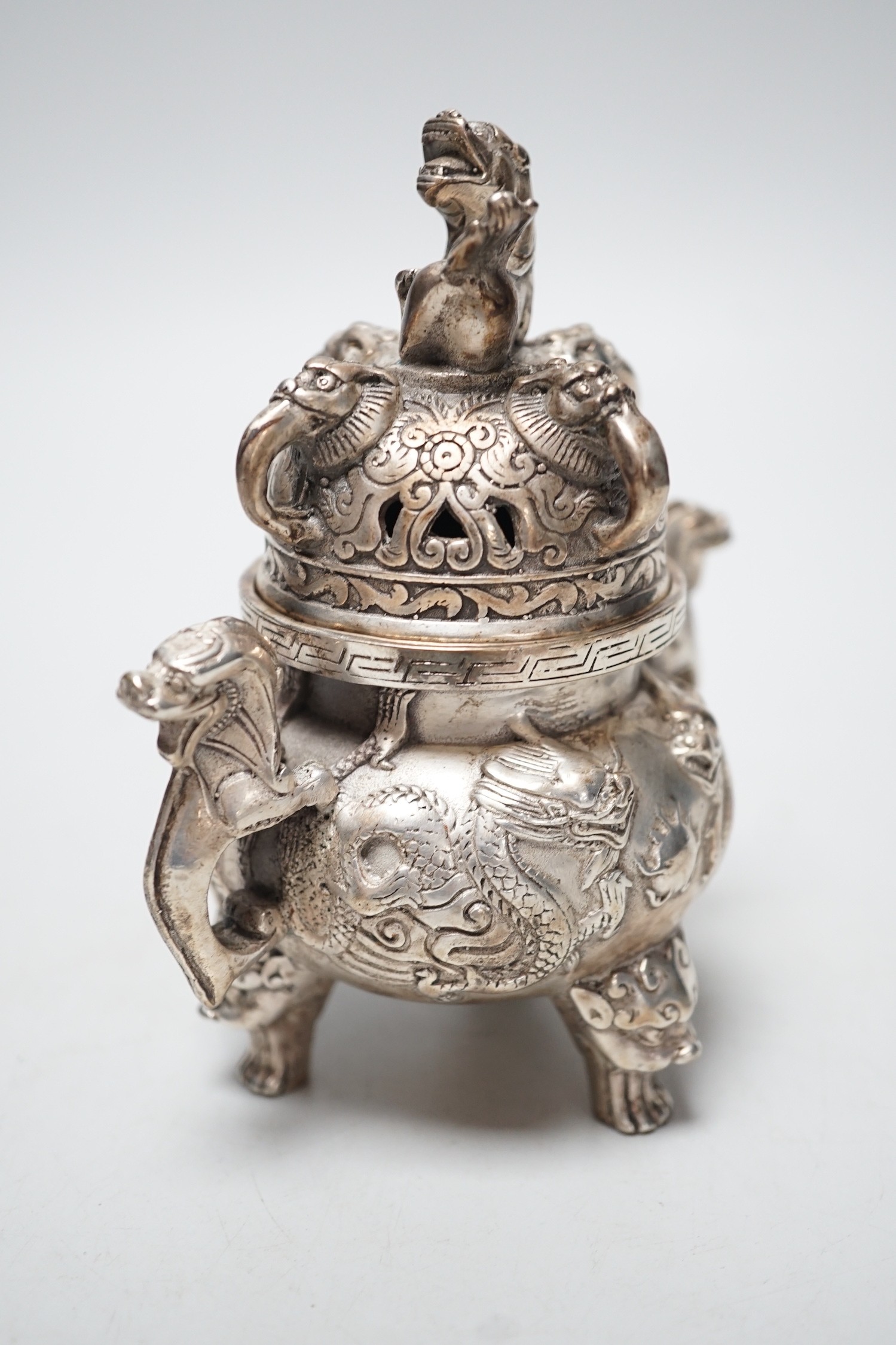 A Chinese cast metal censer and cover, seal mark to base. 13cm tall